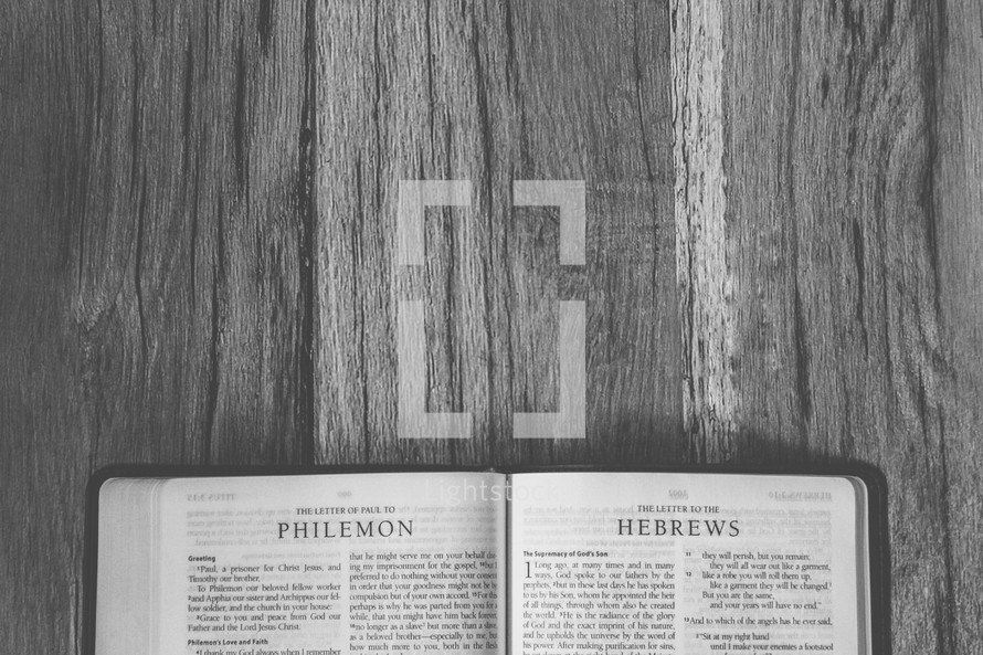 Bible opened to Philemon and Hebrews 