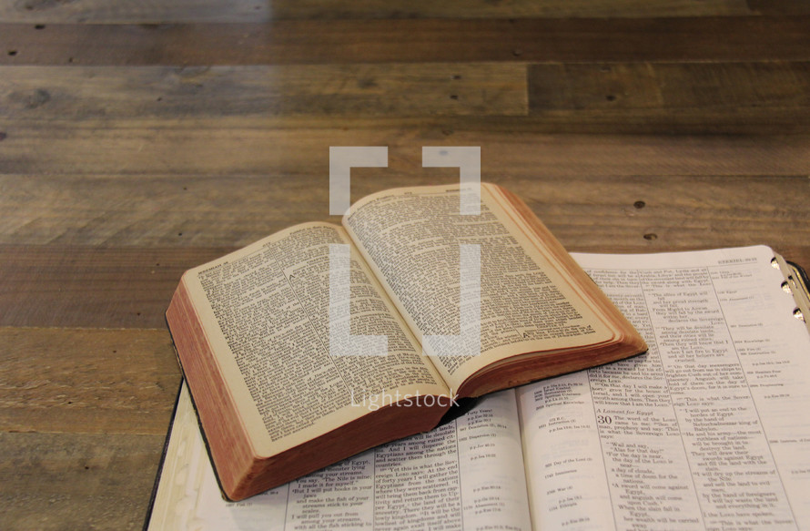 open Bibles stacked on top of each other 