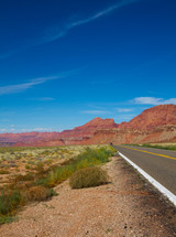 red rock mountain peaks and highway 