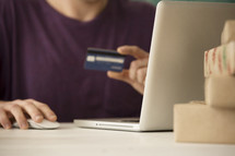 man shopping with a credit card online.