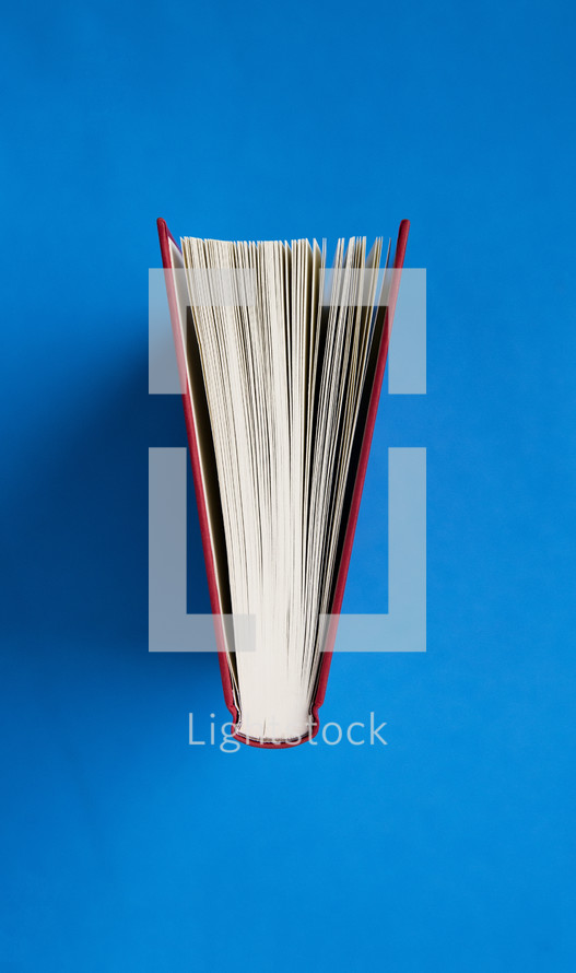 pages of a book on a blue background.