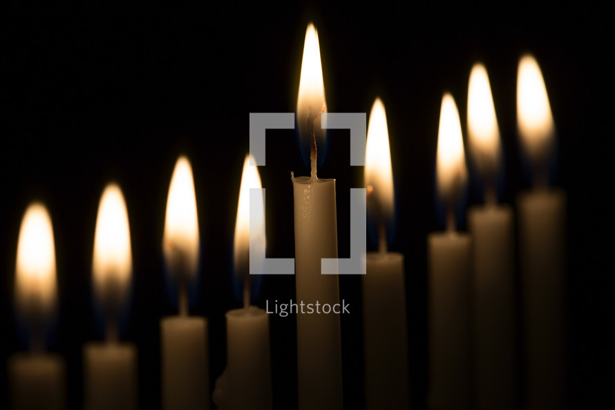 flames on candles against black 