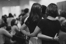 women hugging at church 