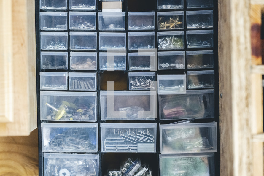 Nails and screws organized in bins