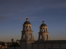 Towers of a beautiful cathedral at sunset