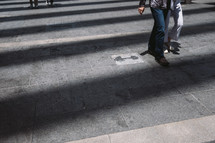 people walking on a city sidewalk 