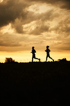 couple running at sunset 