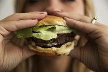 woman eating a burger 