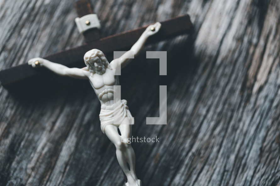 Crucifix on a wooden background
