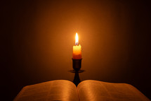 Candlelight photo of a Bible