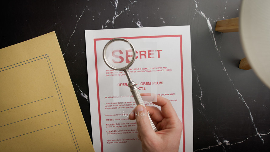Magnifying glass shows the word secret