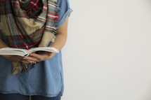 a torso of a woman reading a Bible, fall Bible study 