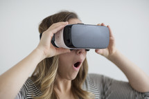 A woman wearing VR glasses