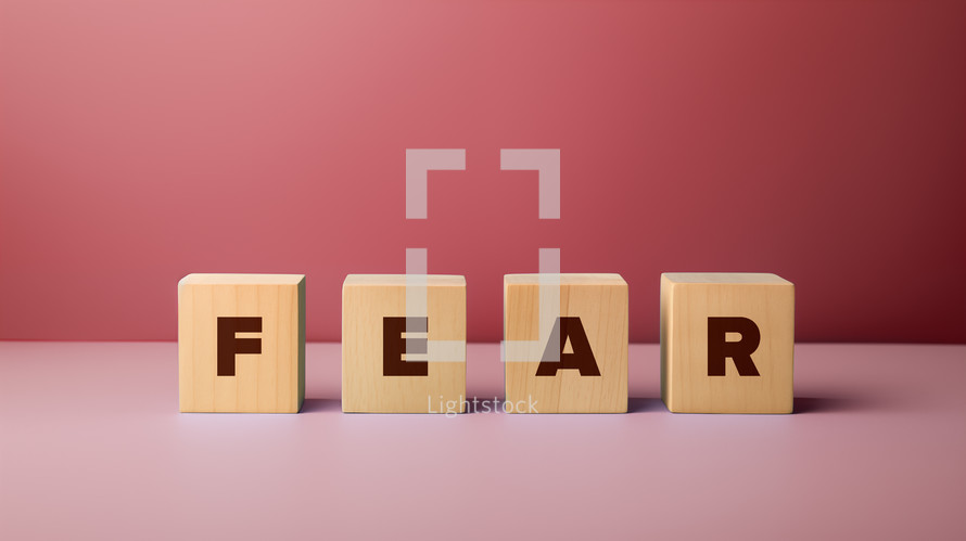 Wooden blocks with the word fear.