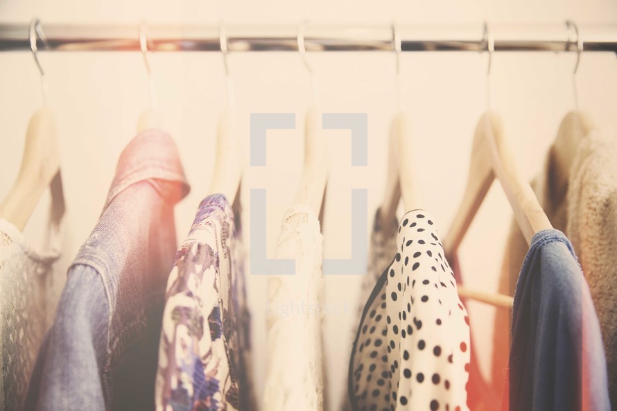 clothes on hangers in a closet 