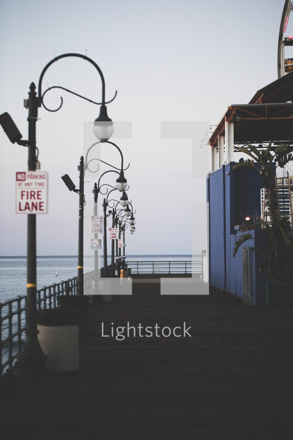 fire lane sign and street lamps on a pier 