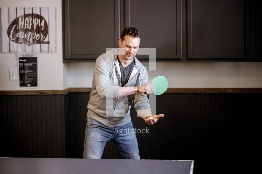 man playing table tennis 