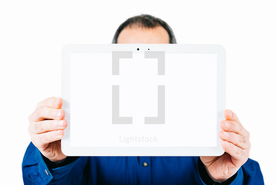 man holding a tablet with a blank screen