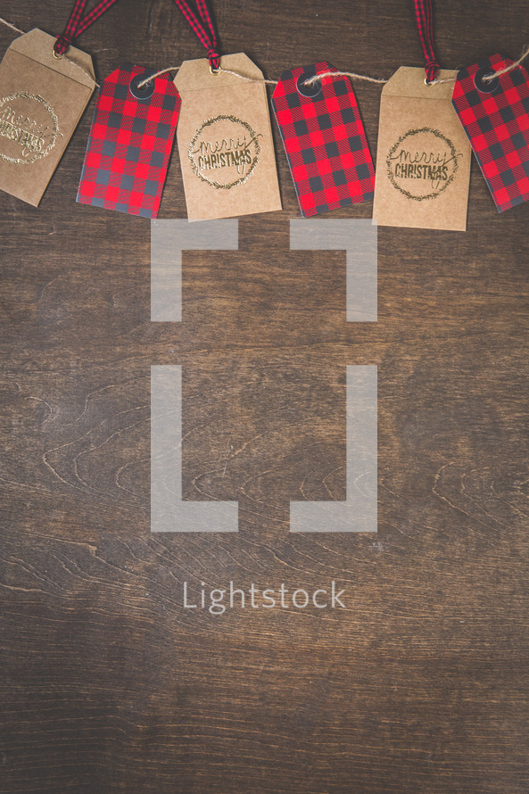 plaid and merry Christmas gift tags on twine 