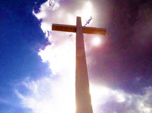 The Bridge between Heaven and Earth - an image of The Cross stretching from the earth up to Heaven surrounded by blue and white clouds and sky. A powerful image of the enduring power of the Cross that takes away the sins of the world through the shed blood of Jesus Christ. 