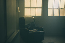 a recliner in a corner 