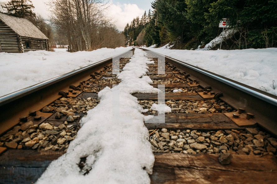 snow on railroad tracks 