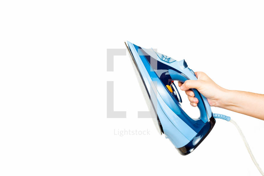 woman's hand holding an iron on white background