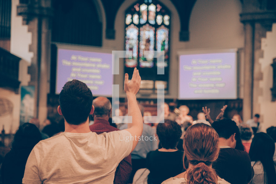 Man with hand raised in worship