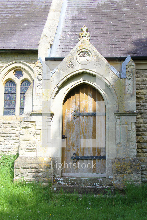 arched wooden door on a church 