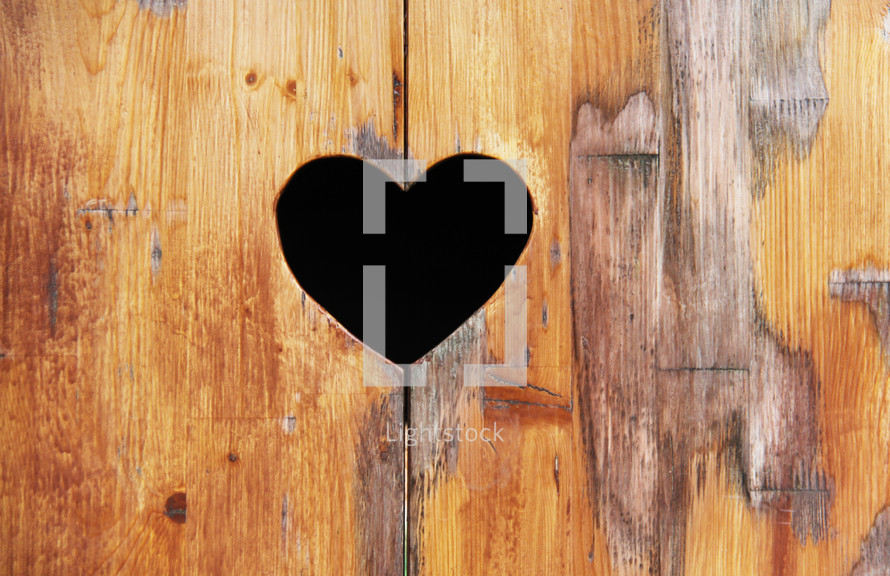 Heart shape in wood background 