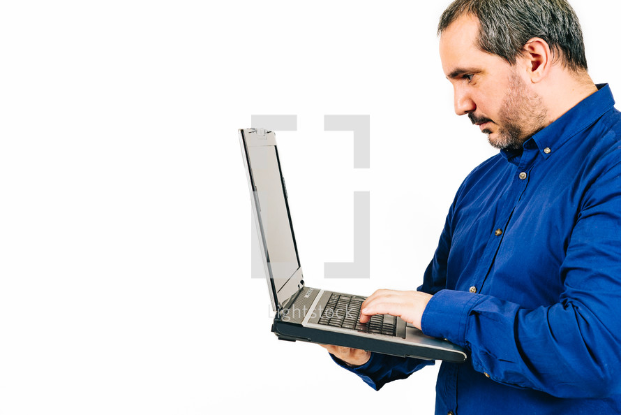 man holding a laptop on a white background