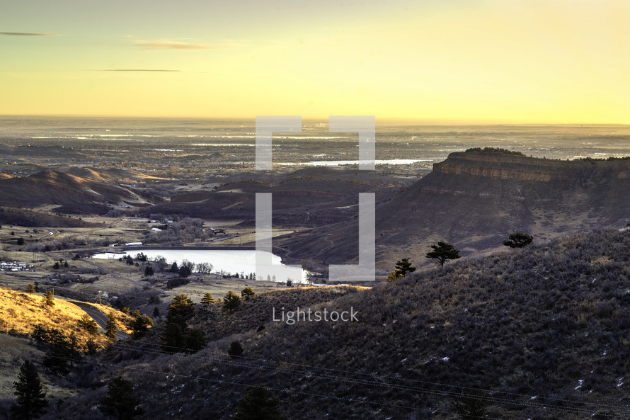 Sunrise over the Northern Colorado town of Loveland. Flatiron reservoir, a popular camping and fishing destination in the foreground