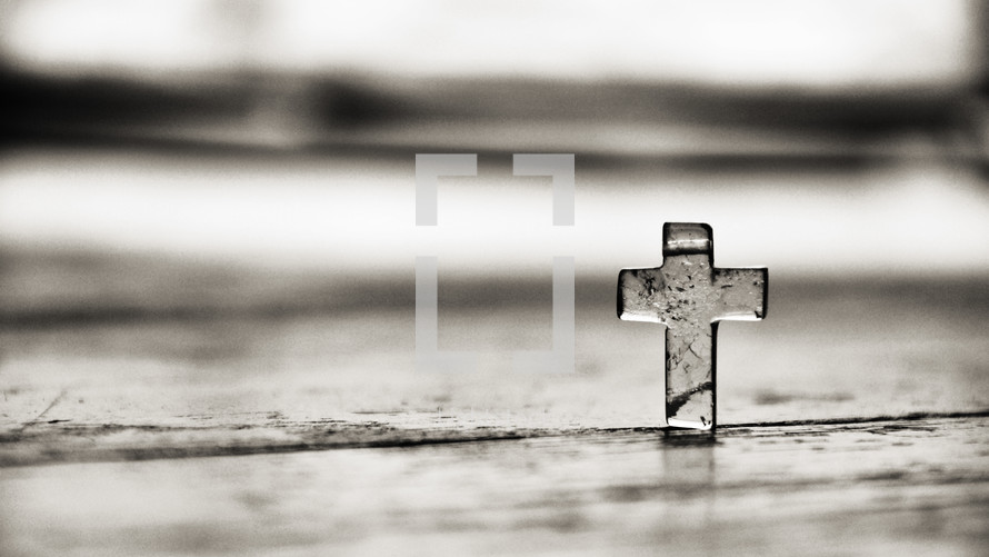 Clear glass cross on background