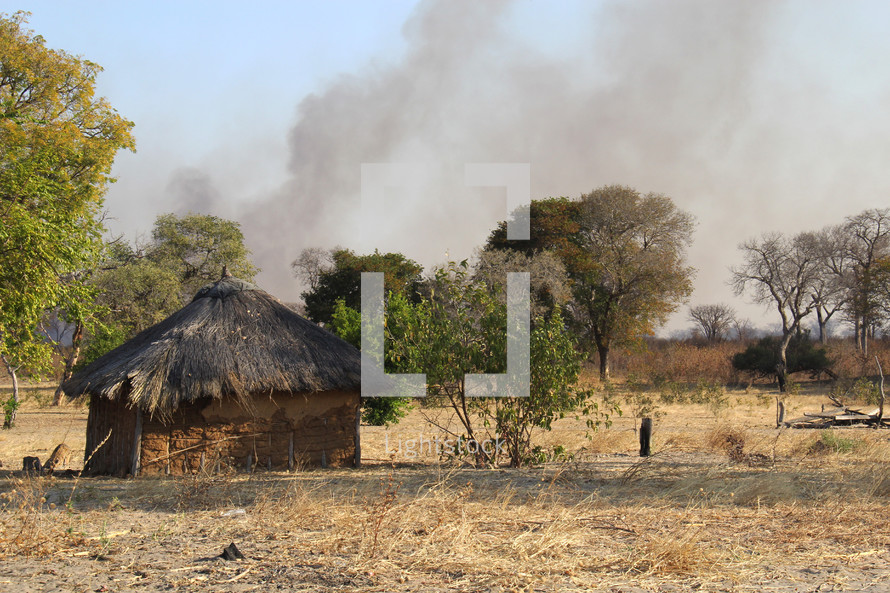 rising smoke from a village 