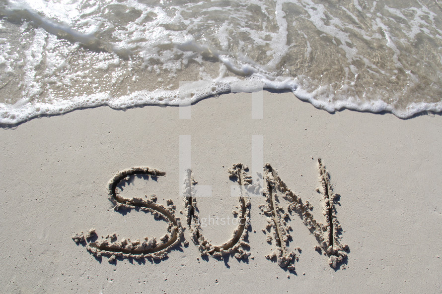 word sun written on the beach 