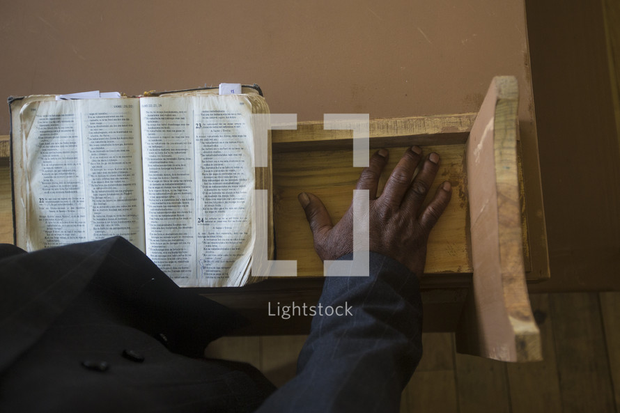 preacher at the pulpit with an open Bible