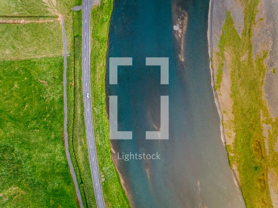 aerial view above a river and highway 