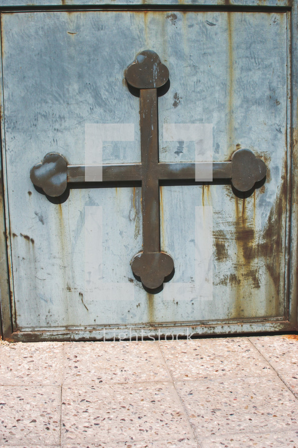 metal cross on a door 