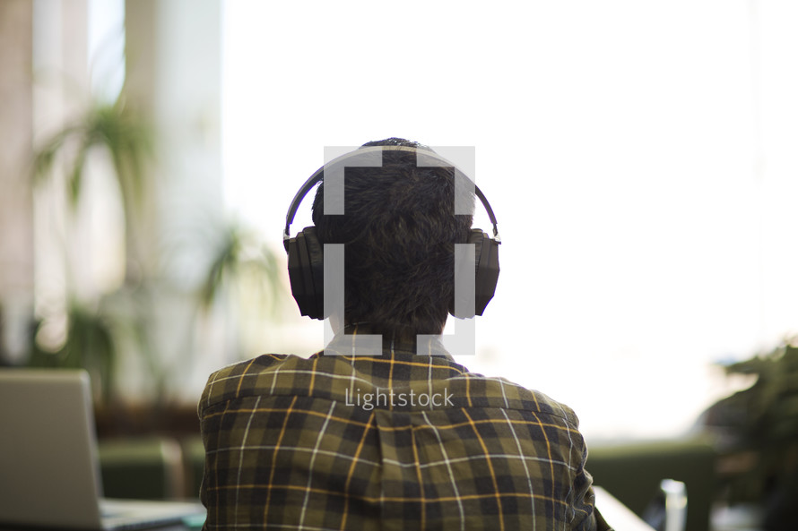 a man listening to headphones 
