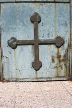 metal cross on a door 