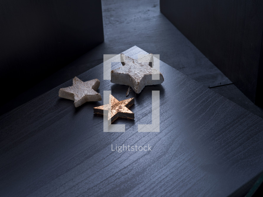 star shapes on black wood 