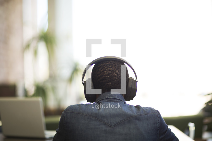 a man listening to headphones