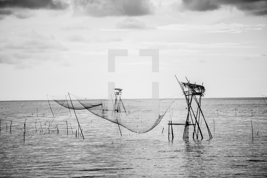 fishing nets over the water 