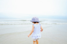 toddler girl on a beach 