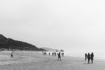 people walking on a beach 
