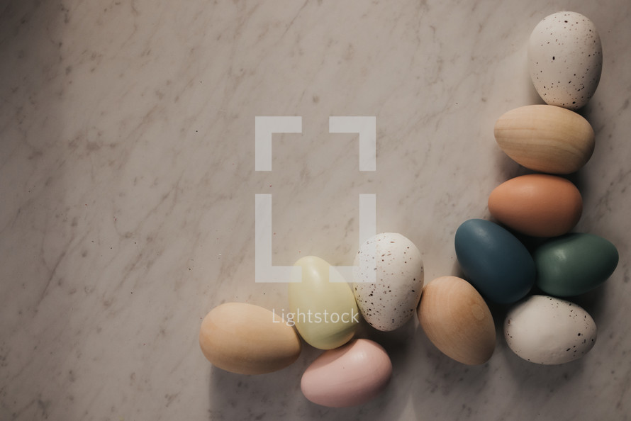 wooden Easter eggs on a marble background 