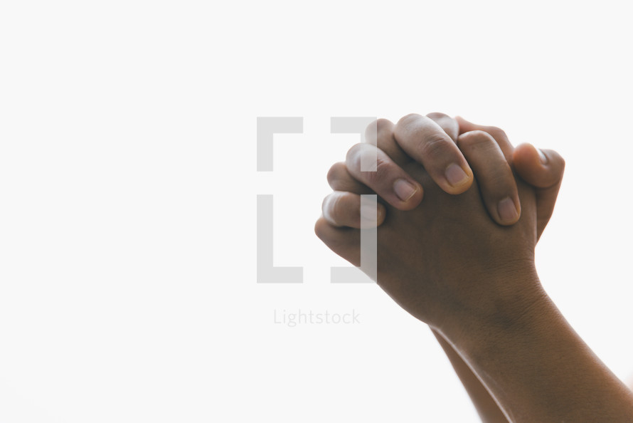 White background and praying hands