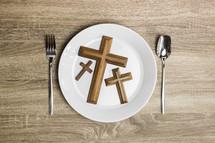 crosses, silverware, and plate 