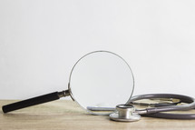 magnifying glass and stethoscope 