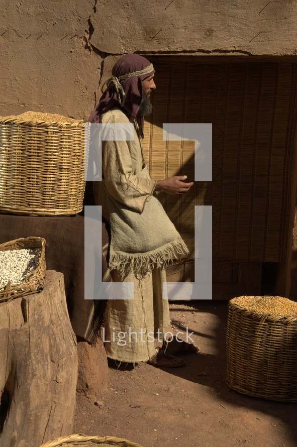 A man selling grains at the market in biblical times 